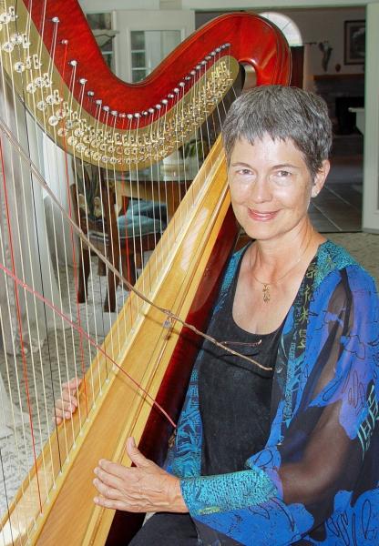 Barbara Kerkhoff poses with her harp