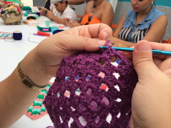 up close of a person crocheting