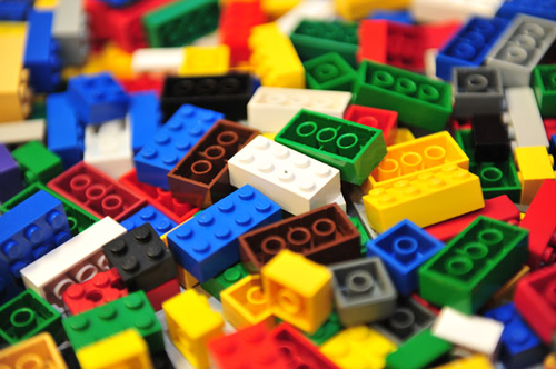 A close up photo of a pile of multicolored LEGO bricks.